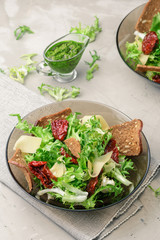 Frisee lettuce salad with sun dried tomatoes