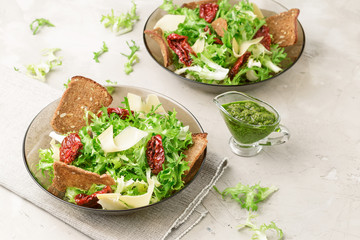Frisee lettuce salad with sun dried tomatoes