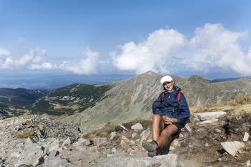 Happy Hiker Woman on the Top of a Mountain with Stunning View 