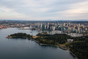 Aerial view of Brockton Point Lighthouse in Stanley Park with Downtown Vancouver City in the background.
