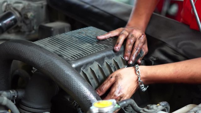 Men are changing the air cleaner filter diesel cars, 4K two shot