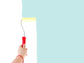 One person painting a white wall with a roller brush