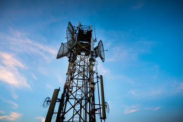 Fototapeta na wymiar Telecommunications antenna for radio, television and telephone with blue sky