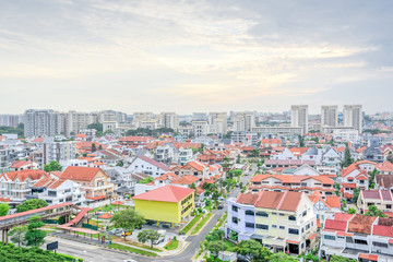 Residential house with high-rise buildings in background in Singapore