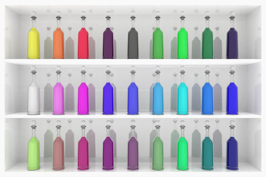 Serie bottigliette colorate con varie sfumature su scaffale..
