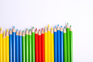  Colorful pencils pattern isolated on white background. Top view colorful of color pencils.Colored pencils, isolated on the white background. Color pencil with copy space isolated on white background,