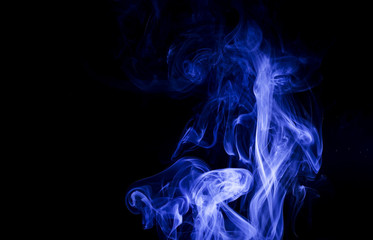 Fototapeta premium Blue smoke on black background