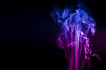 Obraz premium Colored smoke on black background