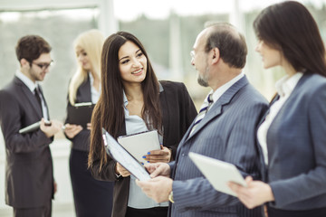 employees discuss their goals before the start of the workshop