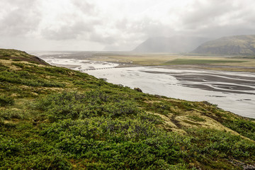 Landscape with a road bridge across the Jakulsa river