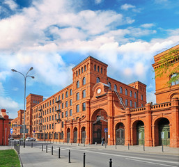 Genuine industrial architecture, with unplastered red brick buildings - obrazy, fototapety, plakaty