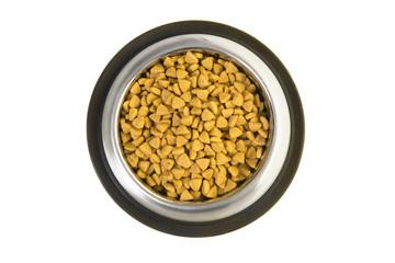Metal feeding bowl filled with cat kibble seen from a high angle view isolated on a white background
