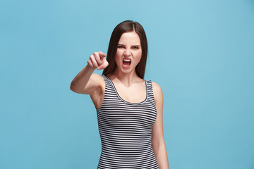 The overbearing woman point you and want you, half length closeup portrait on blue background.