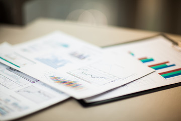 financial charts and graphs on the table