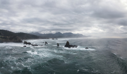 Striking Aerial Panoramic Seascape View during a Vibrant Winter Evening. Taken in Oregon Coast, North America.