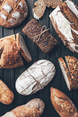 Delicious fresh bread on wooden background