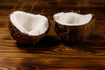 Fresh ripe coconut on rustic wooden table