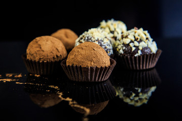 chocolate candies on black background