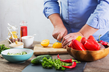 man cooking a vegetarian salad