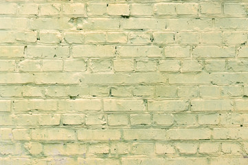 old yellow brick wall texture grunge background, may use to interior design. daylight.