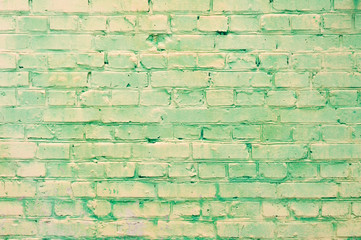 old yellow-green brick wall texture grunge background, may use to interior design. daylight.