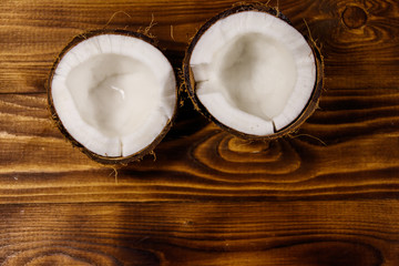 Fresh ripe coconut on rustic wooden table