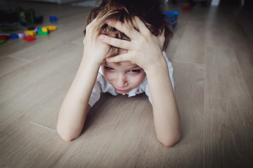 sad child, stress and depression at home