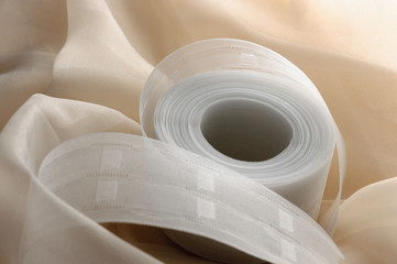 yellow closeup organza fabric wavy texture with ribbon for curtains / tulle