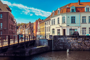 Medieval town Bruges. Old house at vintage street. Bridge over