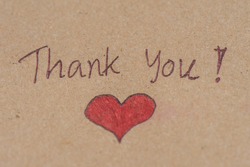 thank you message with red heart on brown paper. Thankful concept.