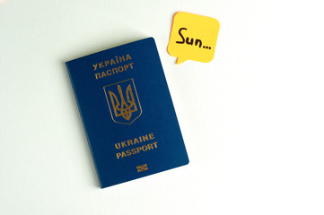 A blue Ukrainian passport says something on a white background. Isolate.