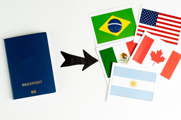Blue clean passport  and several cards with prapors of the world. Says on a white background....