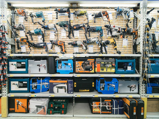 many perforators on shelves in departmeont of DIY store
