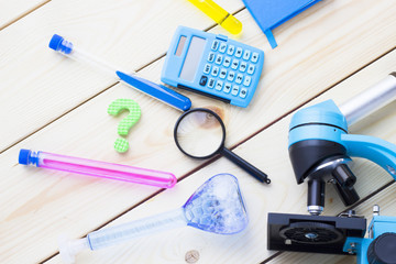 Chemistry class makes chemistry experiment. STEM. Robotics, mechanic, chemistry, biology. Modern education. Fun and interesting. White boards background Top view