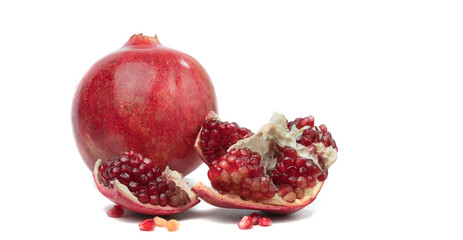 Ripe pomegranate fruit isolated on white background cutout