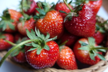 A Ripe strawberries  in the basket, red fruit, plant in countryside farm, feel fresh and sweet, fruit macro photography concept