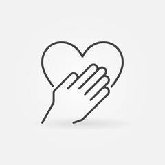 Hand with heart concept vector outline icon