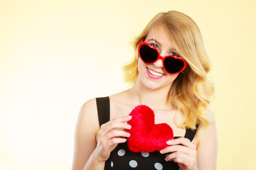 Woman holding red heart love symbol