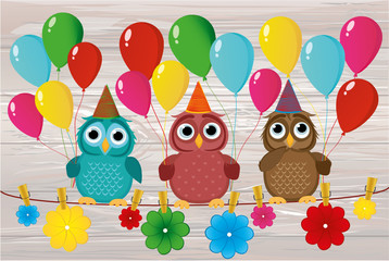 Three lovely owls sit on a rope and hold balloons. Hanging