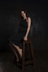 stylish portrait of pregnant woman on dark background