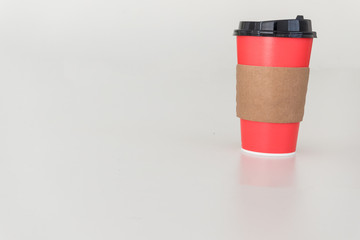 Empty red paper cup isolated on white background