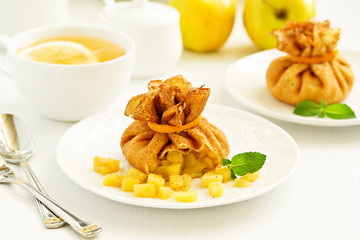 Russian pancakes stuffed with apples and caramel.