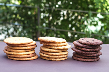  Stacks of chocolate cookies, cookies with chocolate drops, cookies with oatmeal.