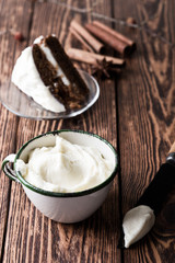 Homemade cream cheese frosting in rural mug