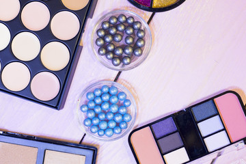 Cosmetic products on white wooden background