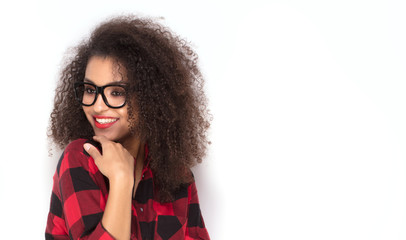 Happy afro girl in red checkered shirt.