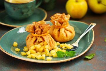 Russian pancakes stuffed with apples and caramel.