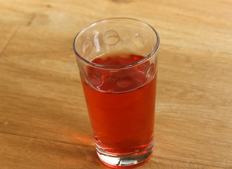 Glass with fresh Strawberry lemonade on wooden background