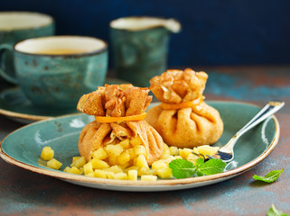 Russian pancakes stuffed with apples and caramel.