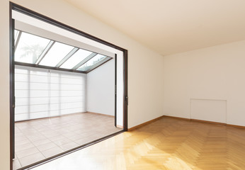 Empty room in a modern house, white walls